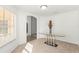 Bright living room featuring a large window letting in plenty of light and a glass table as a focal point at 29 Guava Pass, Ocklawaha, FL 32179