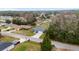 Aerial view of the neighborhood with the home's light blue exterior and gray roof at 3705 Se 137Th Ln, Summerfield, FL 34491