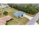 Aerial view of the property and neighborhood highlighting the landscaping at 3705 Se 137Th Ln, Summerfield, FL 34491