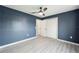 Bright bedroom with modern vinyl flooring, a ceiling fan, and closet at 3705 Se 137Th Ln, Summerfield, FL 34491