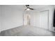 This bedroom features a ceiling fan, closet with sliding doors, and neutral-colored walls at 3705 Se 137Th Ln, Summerfield, FL 34491