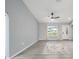 Light and airy living room featuring light walls, modern flooring, and ample natural light at 3705 Se 137Th Ln, Summerfield, FL 34491