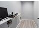 A utility room with light gray walls and wood-look vinyl floors at 3705 Se 137Th Ln, Summerfield, FL 34491