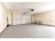 Spacious two-car garage with neutral walls and flooring, perfect for storage or workshop space at 434 Bar Ct, Kissimmee, FL 34759