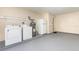 Laundry room featuring a washer, dryer, water heater, and refrigerator at 434 Bar Ct, Kissimmee, FL 34759