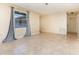 Bright living room featuring tile floors, neutral colored walls, and large window providing ample natural light at 434 Bar Ct, Kissimmee, FL 34759