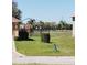 Community playground with swings, slides, and other play equipment visible from front yards of homes at 434 Bar Ct, Kissimmee, FL 34759