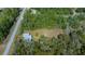 Overhead view of a well-maintained property featuring a lush backyard and a peaceful, secluded setting at 4445 Sw Azalea Ct, Dunnellon, FL 34431