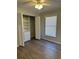 Bedroom features a ceiling fan, a window, and a closet with folding doors and built in shelving at 4691 Se 138Th Pl, Summerfield, FL 34491