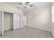 Bedroom with tile floors and a closet with sliding doors at 47 Sequoia Loop, Ocklawaha, FL 32179