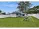 Spacious backyard with play set and well-maintained lawn, great for Gathering activities at 506 Clear Rd, Ocala, FL 34472