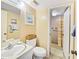 This bathroom offers sink with classic faucet, stylish artwork, and accessible shower at 527 Midway Dr # A, Ocala, FL 34472