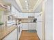 Well-lit kitchen featuring white cabinetry and appliances at 527 Midway Dr # A, Ocala, FL 34472