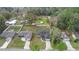 Aerial view of a home in a residential neighborhood with spacious lots and mature trees at 5488 Nw 61St Ave, Ocala, FL 34482