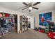 Cozy ' bedroom with a ceiling fan and plenty of storage space for toys and clothes at 5488 Nw 61St Ave, Ocala, FL 34482