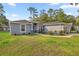 Beautiful single story home showcasing lovely landscaping and a charming front entrance at 5488 Nw 61St Ave, Ocala, FL 34482