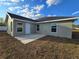 Backyard patio with a light gray single-story home and white trim at 5500 Sw 151St Street Rd, Ocala, FL 34473