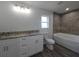 Bathroom with a double vanity, granite countertops and separate tub and shower at 5500 Sw 151St Street Rd, Ocala, FL 34473