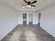 Bedroom with ensuite bathroom and walk-in closet, wood-look flooring, ceiling fan, and recessed lighting at 5500 Sw 151St Street Rd, Ocala, FL 34473