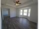 Spacious bedroom with wood-look flooring, a bay window, and neutral paint at 5500 Sw 151St Street Rd, Ocala, FL 34473