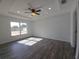 Bright bedroom featuring wood-look flooring, ceiling fan, and recessed lighting at 5500 Sw 151St Street Rd, Ocala, FL 34473