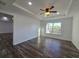 Spacious bedroom featuring wood flooring, a ceiling fan, and natural light at 5500 Sw 151St Street Rd, Ocala, FL 34473