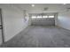 Clean two-car garage with concrete floor and overhead lighting at 5500 Sw 151St Street Rd, Ocala, FL 34473