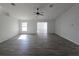 Large, open living room with wood-look flooring and neutral paint at 5500 Sw 151St Street Rd, Ocala, FL 34473