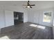 Stylish open-concept living area with neutral tones and wood-look flooring at 5500 Sw 151St Street Rd, Ocala, FL 34473