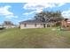 Fenced backyard offers a play set and playhouse, providing outdoor fun for the entire Gathering at 5910 Sw 89Th St, Ocala, FL 34476