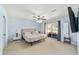 Comfortable main bedroom featuring a ceiling fan and sliding glass doors to backyard at 5910 Sw 89Th St, Ocala, FL 34476