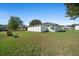 View of the expansive backyard featuring a privacy fence at 6196 Sw 84Th Place Rd, Ocala, FL 34476