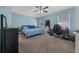 This spacious bedroom offers natural light, a ceiling fan, and ample space at 6196 Sw 84Th Place Rd, Ocala, FL 34476