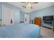 The bedroom is equipped with a ceiling fan and ample closet space at 6196 Sw 84Th Place Rd, Ocala, FL 34476