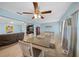 Charming dining area with an open view into the living room, featuring hardwood floors and a modern ceiling fan at 6196 Sw 84Th Place Rd, Ocala, FL 34476