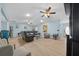 Well-lit living room with light hardwood floors, recessed lighting, ceiling fans, and ample seating at 6196 Sw 84Th Place Rd, Ocala, FL 34476