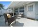 Inviting covered patio featuring comfortable outdoor seating and a relaxing ambiance at 6196 Sw 84Th Place Rd, Ocala, FL 34476