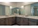 Bathroom featuring double vanity, ample counter space, and neutral color palette at 6367 Sw 70Th Cir, Ocala, FL 34474