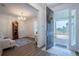 A welcoming foyer featuring a hardwood floors and an open front door, with a view of the neighborhood at 6367 Sw 70Th Cir, Ocala, FL 34474