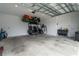 Spacious garage with overhead storage racks and room for vehicle parking at 6367 Sw 70Th Cir, Ocala, FL 34474