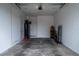 Empty garage features white walls, concrete floor, and plenty of storage space at 6367 Sw 70Th Cir, Ocala, FL 34474