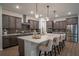 Stunning kitchen features a quartz countertop, stainless steel appliances, and stylish pendant lighting at 6367 Sw 70Th Cir, Ocala, FL 34474