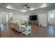 Bright living room featuring neutral furniture, recessed lighting, and an open layout at 6367 Sw 70Th Cir, Ocala, FL 34474