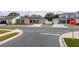 Exterior of a green-painted single-story house with a two-car garage, landscaping, and a concrete driveway at 6367 Sw 70Th Cir, Ocala, FL 34474