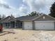 Charming single-story home with two-car garage and neutral gray color palette at 6698 Sw 179Th Avenue Rd, Dunnellon, FL 34432