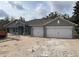 Charming single-story home with two-car garage and neutral gray color palette at 6698 Sw 179Th Avenue Rd, Dunnellon, FL 34432