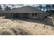 Gray single story home with a dark roof and unfinished backyard at 6943 Sw 179Th Court Rd, Dunnellon, FL 34432