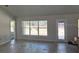 New home living room with tile floors, large windows, and natural light at 6943 Sw 179Th Court Rd, Dunnellon, FL 34432