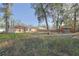 Large backyard with mature trees and a playset at 6950 Se 124Th Ln, Belleview, FL 34420