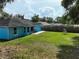 Large backyard featuring a grassy lawn, patio, and swing set, perfect for Gathering fun at 6950 Se 124Th Ln, Belleview, FL 34420